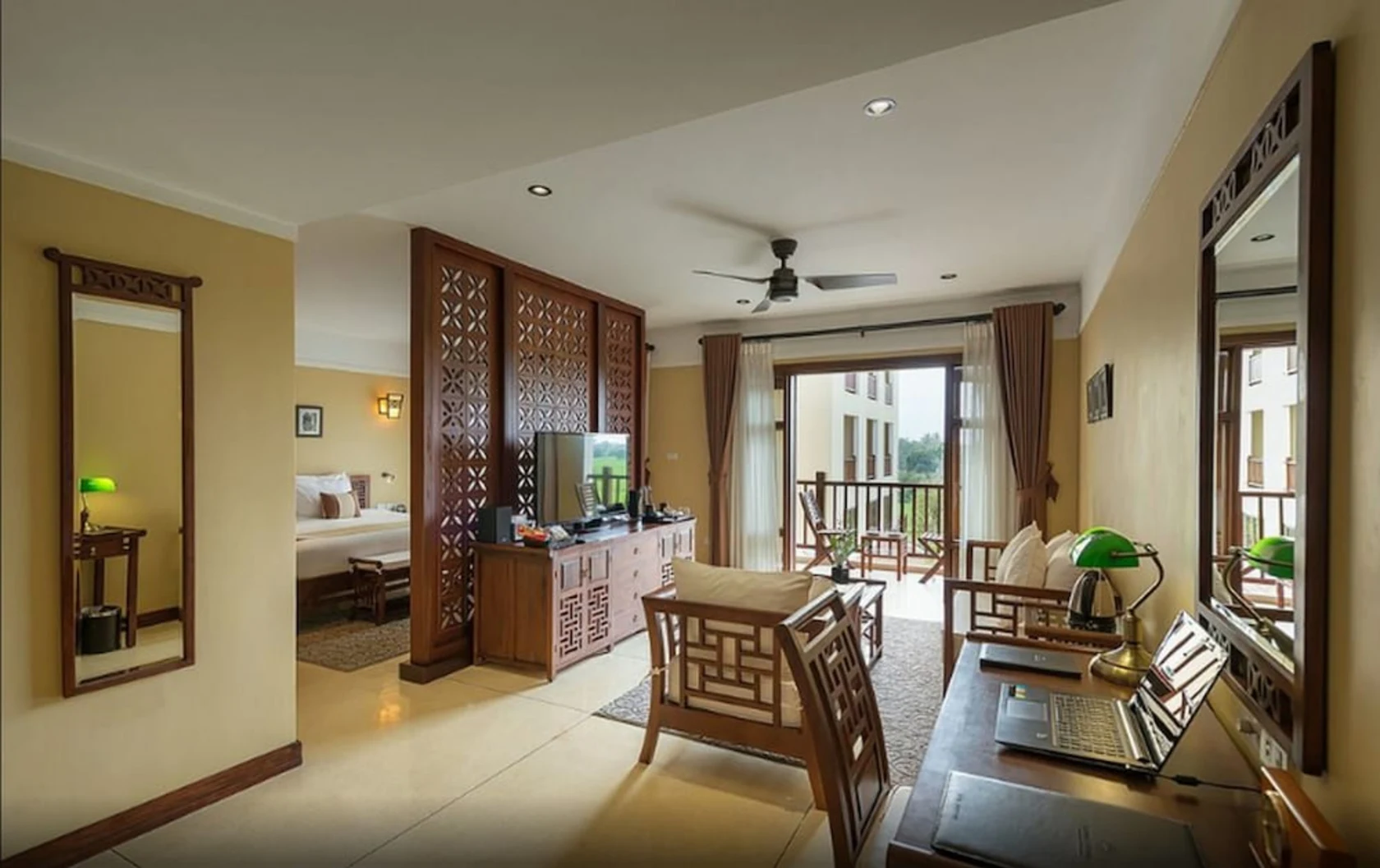 Palm-lined pathway weaving through La Siesta Hội An