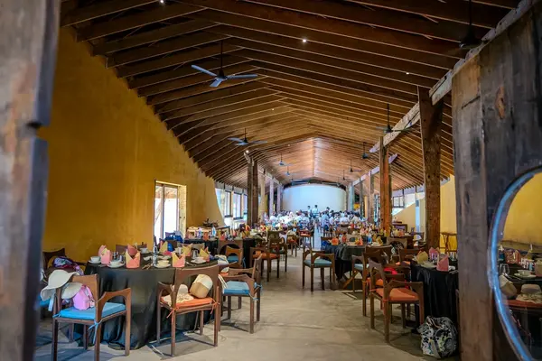 Chef plating a course at Reu Dining