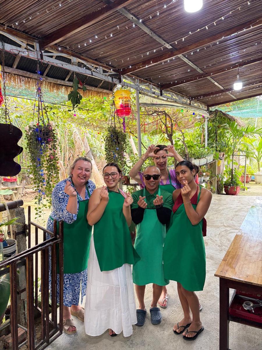 Guests raising chopsticks after class